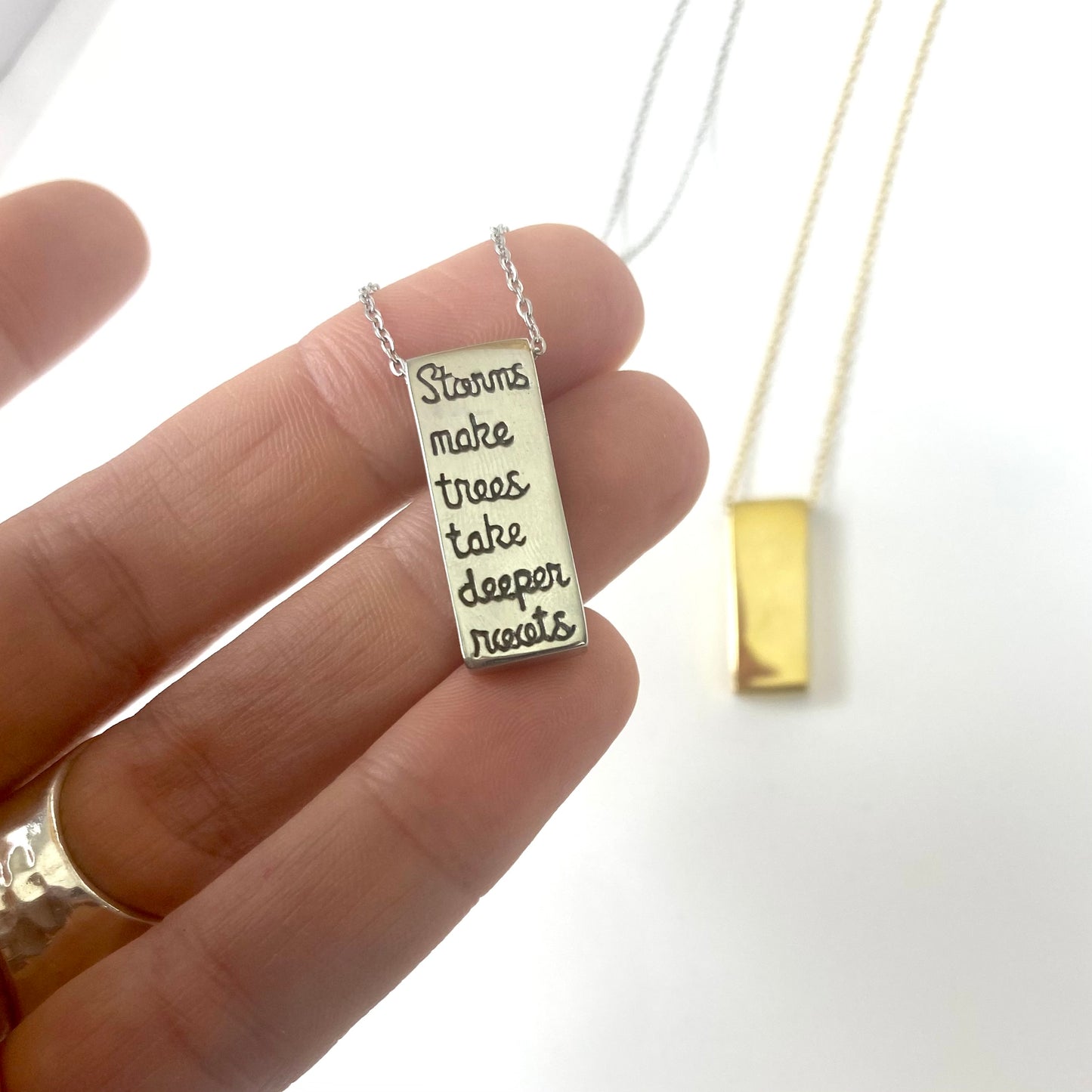 "Storms Make Trees Take Deeper Roots" Rectangle Pendant