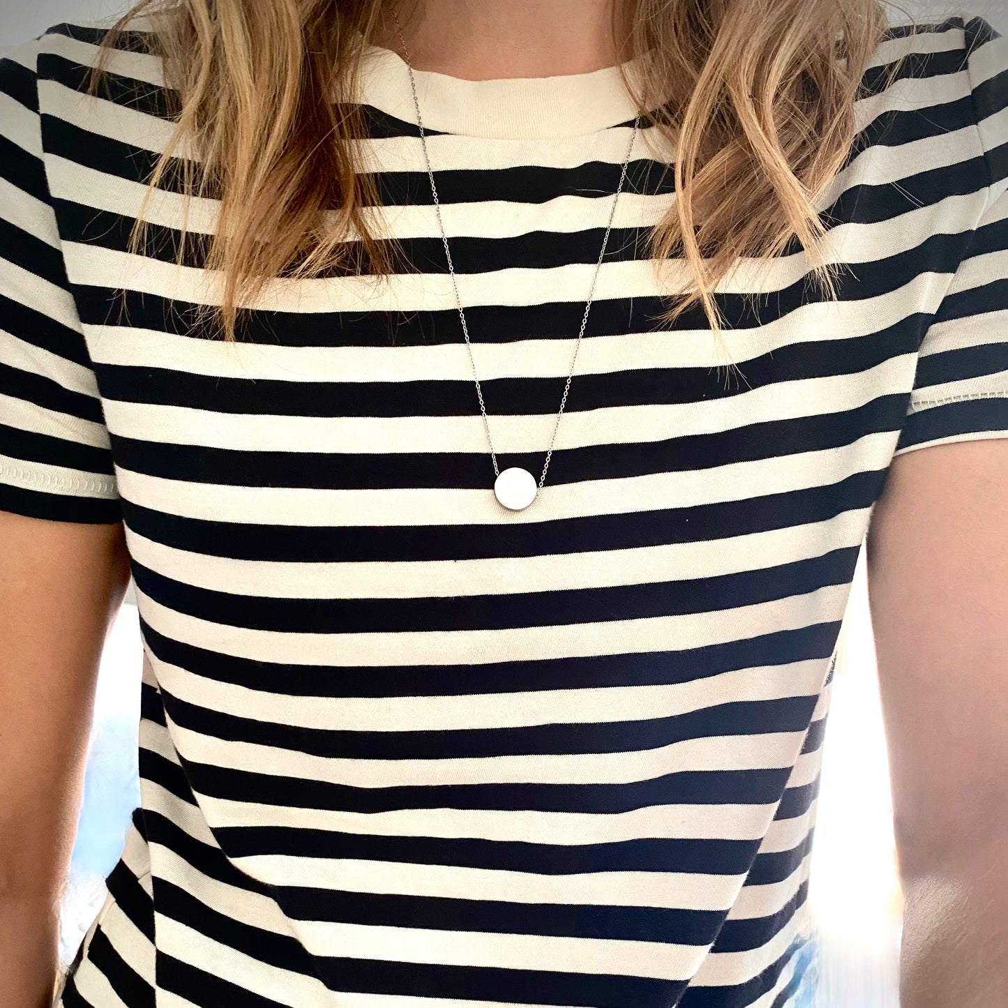 let it be necklace length picture on striped black and white shirt. Necklace hangs mid chest. 24" chain